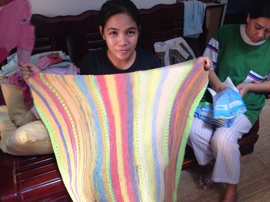 Helen with one of mum's hand- knitted blankets