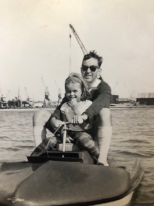Early love of boats, with Dad at the St Peter Port Boating lake   