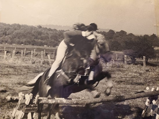 Lee in her happy place, with the horses