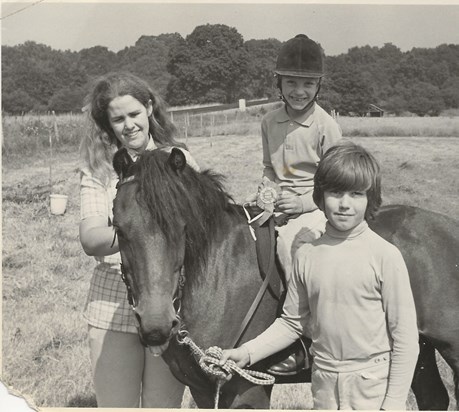 Mum teaching riding