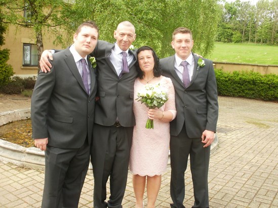 Our wedding day, posing here with "the lads" as Chris called them