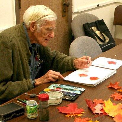 Jack painting leaves in class
