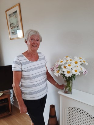 Gran posing by some lovely daisies