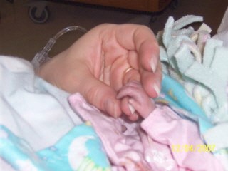 Amanda's perfect little hand, comforting mommy....