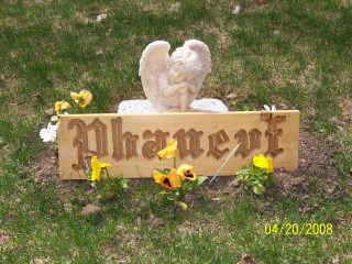 Temporary spring memorial until stone is put in. Angel and flowers given by Nana and Granddad