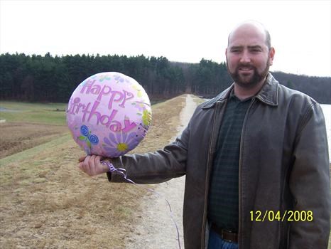 Daddy holding one balloon!