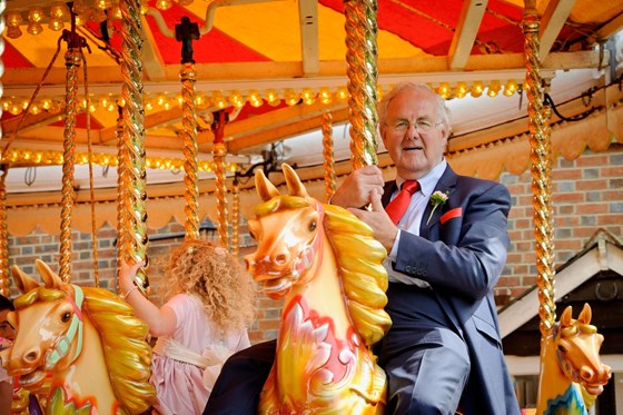 Ken enjoying the carousel having just married Philip & Laura (July 2012)