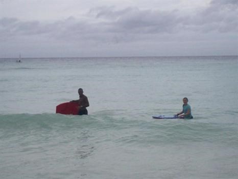 Wayne & Honour enjoying surfing in barbados