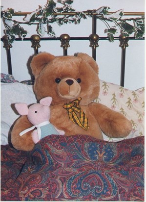 Bigbear and Piglet in their brass bed