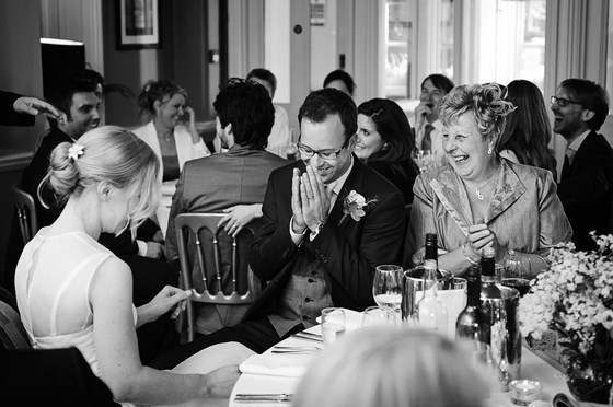 Mum having a giggle during speeches at Sam and Issy's wedding