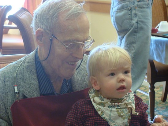Great-grandfather Bill with baby August at a birthday celebration