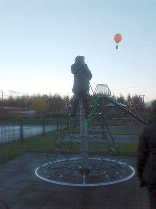 daniel sending up the first of the memorial balloon he wrote" i wish i'd had the chance to meet you"