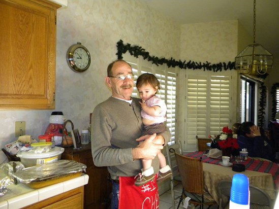 Tom with Evie on Christmas morning 2011