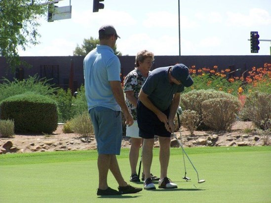 Jason, Sharon and Tom golfing
