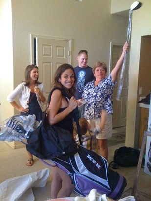Nikkis birthday new golf clubs and mom in background