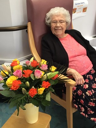 Mum February 2020 with her birthday flowers 