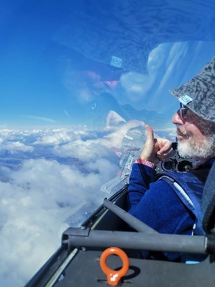 Thumbs up from south island New Zealand/Ron in the front seat of a Duo over Lake Ohau