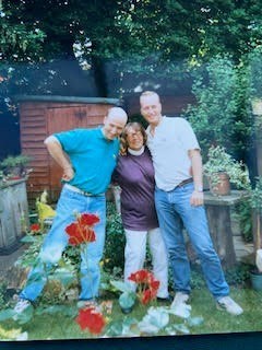 With Carleton and Adam towering above Mum in the garden
