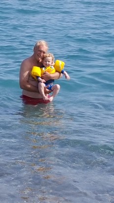 Sharing Curium beach with his favourite little people