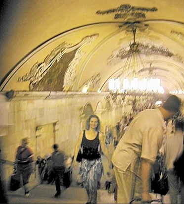 Thelma coming up the Moscow metro steps