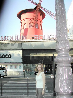 a sweet woman outside the Moulin Rouge
