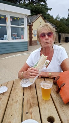 Enjoying a crab baguette at the seaside