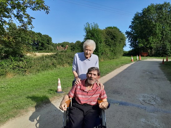 Pops and Mum outside the works shed.