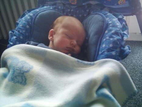 fast asleep in his swing