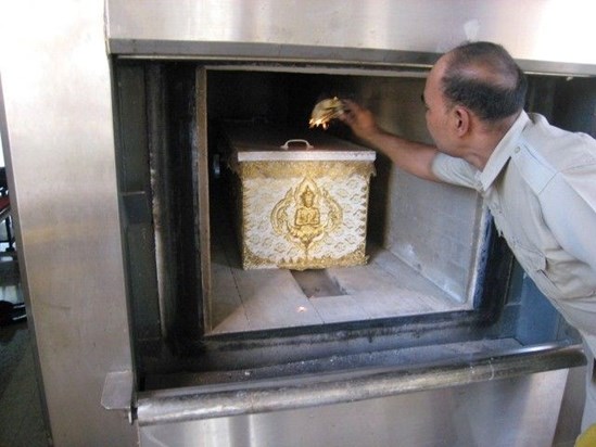 10 Temple Staff Places the Burning Flower on top of the Coffin