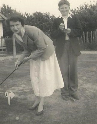 Maureen playing croquet with Roger (brother)
