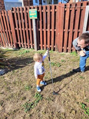 Keeping the life long tradition in place..............creating another generation to keep the crazy golf in the family.