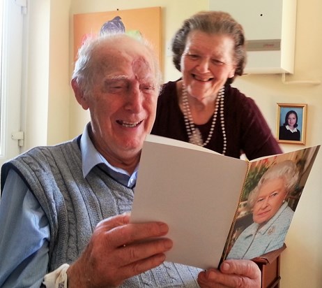 Great joy! Roy and Maud on their Diamond Wedding anniversary receiving Congratulation card from Queen Elizabeth 11. 