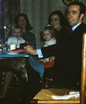 Elspeth holding Nick, with my Mother (Eve) holding me (Lisa), and my father (David).  Xmas time dinner party c1968/9 .Oxford.