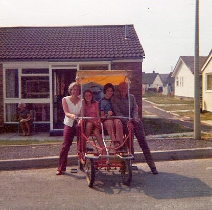 At the bungalow (Grandma Massey in the background)