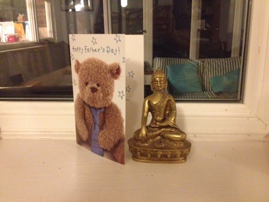 A Buddha in the dining room, beside a Father's Day card for 2015 from Will (via Harri)