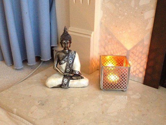 A new Buddha in our front room, the candle lit to remember Will on special days.
