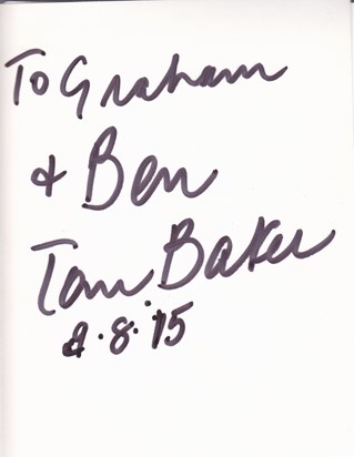 Tom signs the back of my photograph.....
