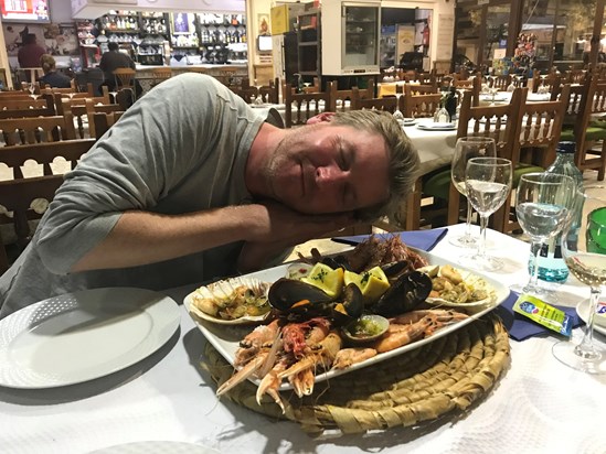 Sam White enjoying a platter of seafood, trip to Spain 2019