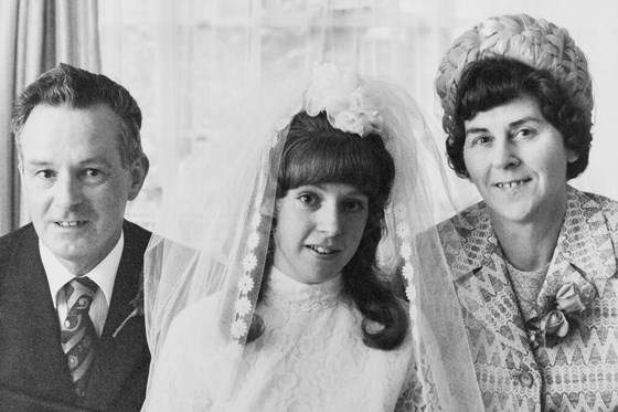 On her wedding day with her father Ted & mother Sheila Lawrence. 