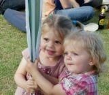 Billie and her sister Frankie trying to hide behind a tiny pole :)