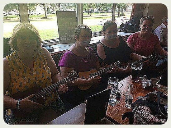 Playing the ukuleles Mam donated to the guys at the Wolf's Castle