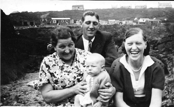 Dad as a baby with his parents and grandmother