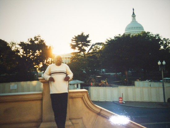 Wesley enjoying vacation in Washington in front of  sunset.