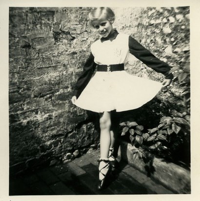 Maureen, age 8, in her dance dress