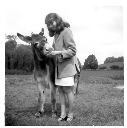 Maureen with a donkey, 1960s