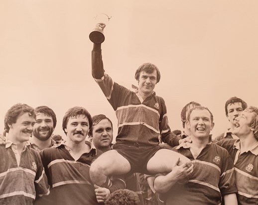 Lifting the trophy as captain at Luton RFC. 