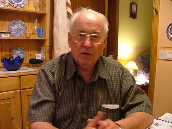 Jim at Moira's house, 2004. The book on the table is his genealogy photobook.