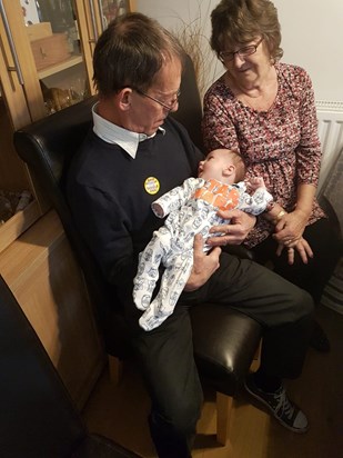 His 69th Birthday with the first great grandchild