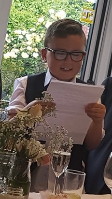Reading his speech at Nicky and Wills’ wedding. 