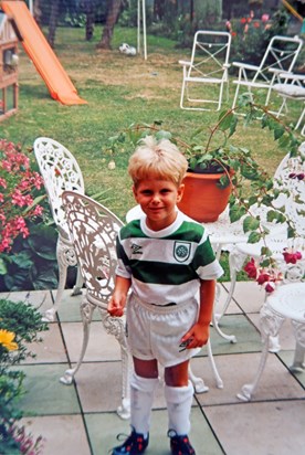 Sam's first kit!! Celtic, no idea why. Still have it too, and the boots Lineker Bullets